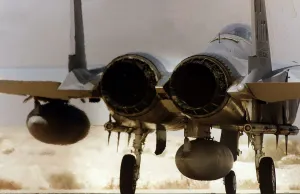 A McDonnell Douglas F15 Eagle of the USAF stands on the end of the runway ready to depart