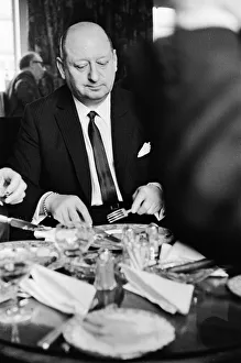 Media Mogul Lord Lew Grade seated at the table at a dinner party. 24th January 1967
