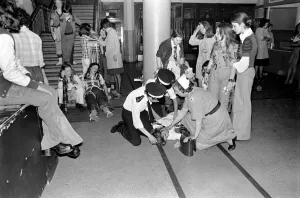 Medical officers attend to injured fans of the Bay City Rollers at their gig in Cardiff