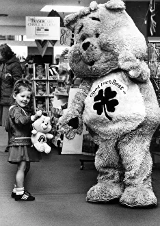 Department Store Prints: Melissa, aged three, meets the Good Luck Bear during celebrations at Rackhams