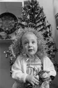 Meltham Fire Station Christmas party - young girl with tinsel wrapped round her head
