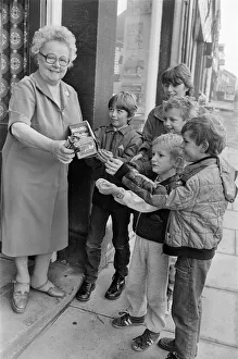 Meltham newsagent Mrs Annie Woodhead pictured keeping up the village tradition of giving