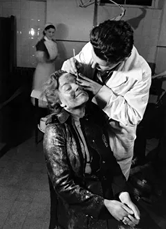 00001 Prints: A member of the AFS Fire Service seen here receiving treatment for an eye injury