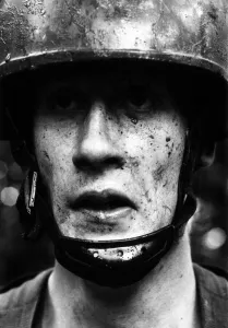 A member of the British Armys Parachute regiment seen here splattered with mud