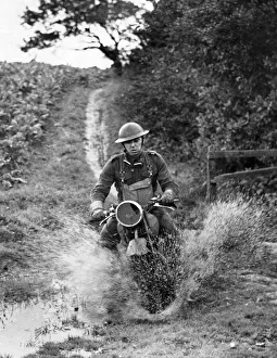 01450 Prints: A member of a company of mechanised troops who are being trained in the North West in