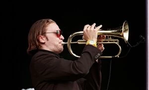 Images Dated 1st July 1999: Member of the Fun Loving Criminals on stage playing the trumpet at T in the Park July