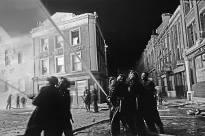 Members of the Auxiliary Fire Service and London Fire Brigade seen here fighting a fire