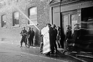 Members of the Auxiliary Fire Service and London Fire Brigade seen here fighting a fire