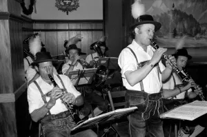 00067 Prints: Members of a Bavarian band performing wearing traditional Bavarian dress during a night