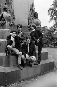 Members of the British pop group The Kinks posing in a London park