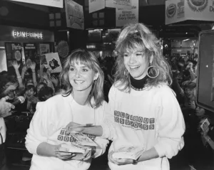 Members of Bucks Fizz - Shelley Preston and Cheryl Baker sign autographs for hundreds of