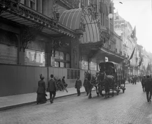 Members of the Civil Guard standing guard outside a Brussels shop wrecked by a mob