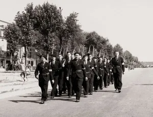 Infantry Prints: Members of the FFI Resistance movement parade through Paris following the liberation of