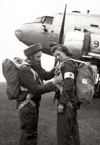 Parachute Prints: Two members of the Flying Sisters, a new airborne British nursing unit prepare their