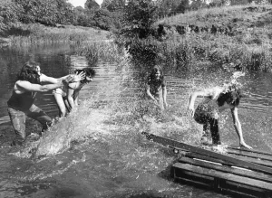 00329 Prints: Members of Heavy Metal group Black Sabbath messing about on the river in the scenic Wye