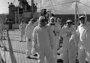 Members of the press and naval ratings aboard HMS Alert 35 miles offshore of Malden