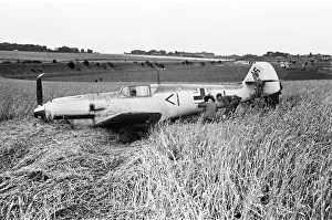 Members of the RAF technical team examine a downed Messerschmitt BF109 during the Battle