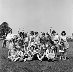 Team Prints: Members of the Torpedo Football Team at Reading with their wives and children