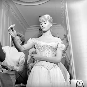 00790 Prints: Members of the Wardrobe and make-up departments at Pinewood Studios help the actresses
