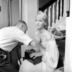 00790 Prints: Members of the Wardrobe and make-up departments at Pinewood Studios help the actresses