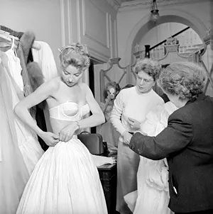 00790 Prints: Members of the Wardrobe and make-up departments at Pinewood Studios help the actresses