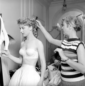 00790 Prints: Members of the Wardrobe and make-up departments at Pinewood Studios help the actresses