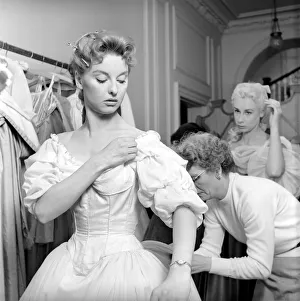 00790 Prints: Members of the Wardrobe and make-up departments at Pinewood Studios help the actresses