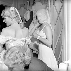 00790 Prints: Members of the Wardrobe and make-up departments at Pinewood Studios help the actresses