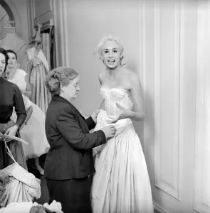 00790 Prints: Members of the Wardrobe and make-up departments at Pinewood Studios help the actresses