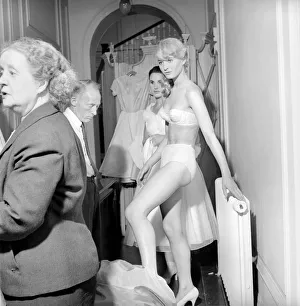 00790 Prints: Members of the Wardrobe and make-up departments at Pinewood Studios help the actresses
