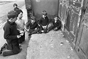 00187 Prints: Memories of pre-war cigarette cards are stirred by this scene of young boys playing with
