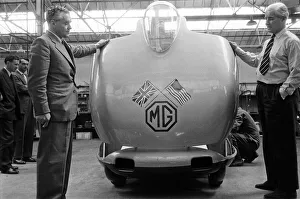 01303 Prints: Men, including Syd Enever and Tommy Wisdom looking at the MG EX181 which is being worked