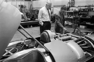 01303 Prints: Men, including Syd Enever and Tommy Wisdom looking at the MG EX181 which is being worked