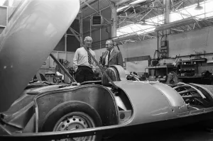 01303 Prints: Men, including Syd Enever and Tommy Wisdom looking at the MG EX181 which is being worked