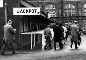 Men joining the queues to place their bets at the totes Betting shops Circa