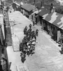 Men and Ladies from a regiment (unknown) at an Army Camp in England (location unknown
