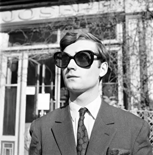 Men modelling the latest 1963 menswear designs in the streets of Paris. April 1963