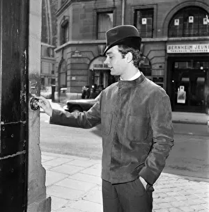 Men modelling the latest 1963 menswear designs in the streets of Paris. April 1963