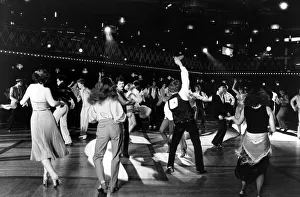 Disco Prints: Men and women disco dancing in dance hall - October 1978 Dancing - Disco dancing