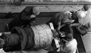 Repairs Prints: Men at work, fitting a large part to the the Queen Elizabeth cruise liner May 1960