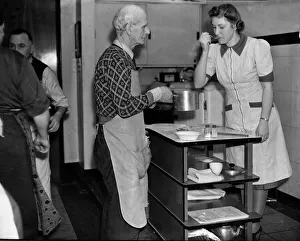 Saucepan Prints: Mens cooking class, February 1944 An elderly man has his food tasted by one