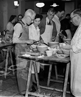 Housework Prints: Mens cooking class, February 1944 Men preparing their food in the class in