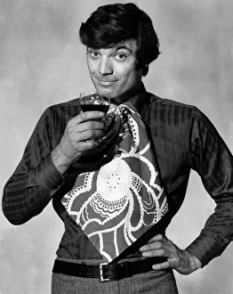 00197 Prints: Mens Fashion Bib Tie Man modelling bib tie drinking a glass of wine