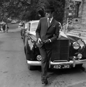 Mens Fashion: Leaning Against the Rolls Royce is Tony Newton in a two-piece suit in silk