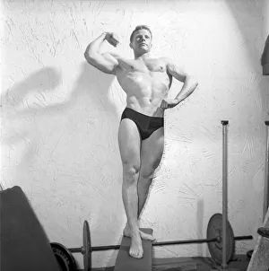 Mens Health: Body builder Larry Stevens seen here posing in the gym. 1957