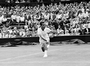Logo Prints: Mens Singles action during the Wimbledon Lawn Tennis Championships. June 1953