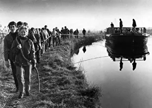 Merseyside teenagers take part in a sponsored pull of a 100 year old coal barge