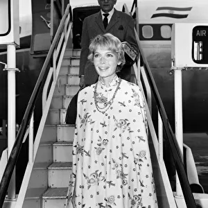 Mia Farrow arrives at Heathrow Airport from Delhi after visiting the Maharishi meditation