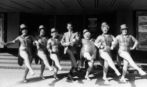 Michael Barrymore and the Roly Polys pose outside Coventry