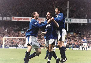Everton Prints: Michael Branch of Everton celebrates a goal against Leicester congratulated by teammates